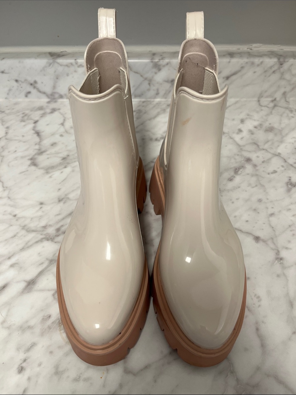 Dolce Vita Glossy plastic Cream Chelsea Booties with Tan Lug Sole